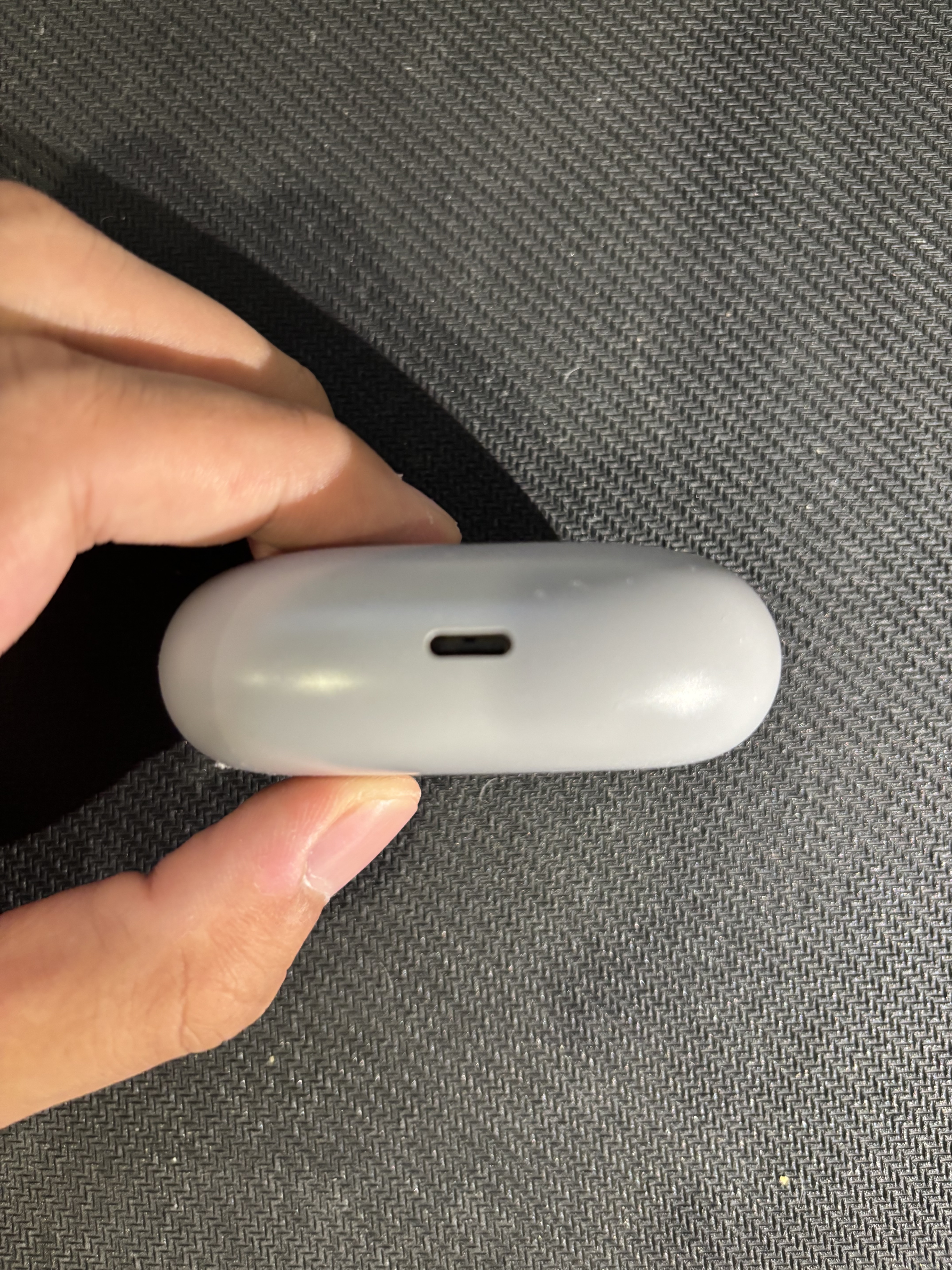 Image of earphone case, bottom view